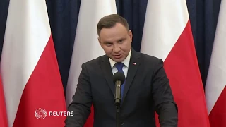Poland's president says he will sign Holocaust Bill