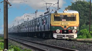 Old but dazzling green face EMU local train arrival and departure