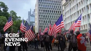 Hong Kong protesters wave American flags asking for help