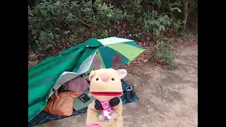 Camping under a beach umbrella