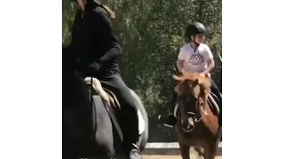 Harper Beckham riding a horse