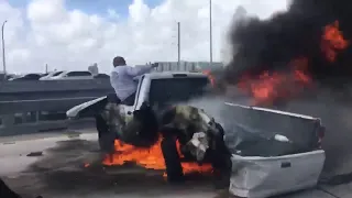 Heroic Good Samaritan jumps into action after driver became trapped inside flaming pickup truck