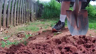 Turning soil by hand with a shovel