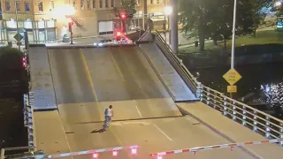 Bicyclist Weaves Past Barriers & Falls Into Draw Bridge Gap