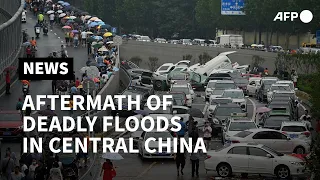 Flood aftermath: Pile up of cars on road in China | AFP