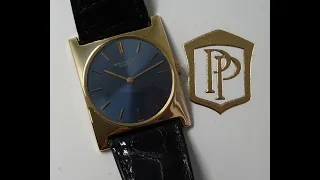 1968 Patek Philippe 18k Gold men's dress watch with satin blue dial.  Model reference 3557
