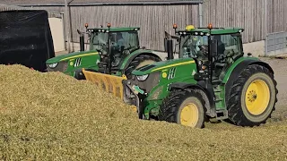 John Deere 6215R's both with Albutt buckrakes on the clamp for Maize silage.
