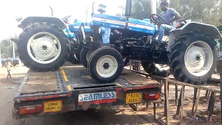 Powertrack 439 Plus tractor loading on the truck