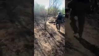 Ukrainian servicemen pass by the destroyed BMP-1 of the Armed Forces of Ukraine.  Presumably,