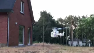 Belgium police helicopter lands in backyard of house.