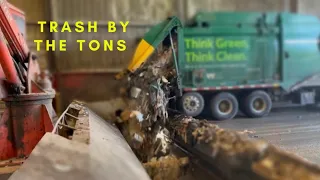 Watch Garbage trucks dumping Tons of Trash in the Hole!