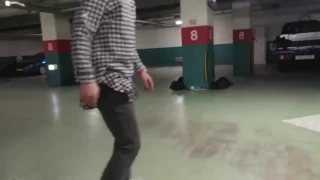 Guy Longboards Through Parking Garage