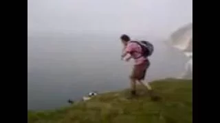 man falls down cliff