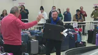 Passenger releases joyful outburst after finding lost luggage