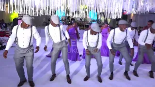 UGANDAN GROOMSMEN AND MAIDS DANCING CHECKECHA ON A WEDDING