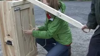 How to use a hand hay baler