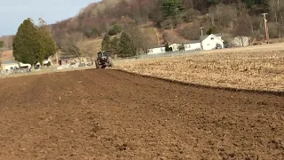 International 5088 plowing with five bottom plow