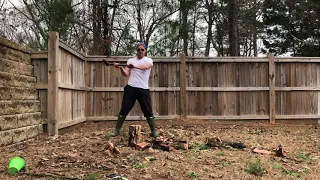 Hillbilly splitting wood with an axe