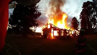 Helmet Cam video of large house fire with rollover flashover and backdraft