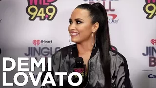 Demi Lovato talks with JV and Selena backstage at The WiLD 94.9 Jingle Ball 2017