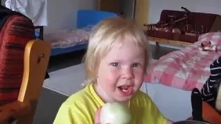 A little girl eat onion