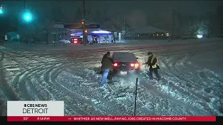 CBS Detroit crew helps driver stuck in snow