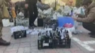 Ukrainians in Kyiv prepare Molotov cocktails