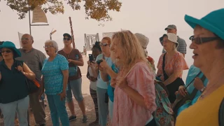 Joshua singing "Shalom" on the Sea of Galilee to an Israel Tour Group