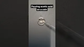 Pouring acetic acid on a coin