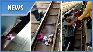 Moment miracle baby lives after falling onto tracks and under a moving train in India