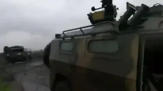 Ukrainian troops inspect a captured Russian Tigr-M