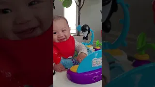 Baby Theo is surprised his new toy is talking to him