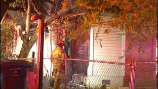 Pair safely escape early morning house fire; cause of fire to be determined, firefighters say