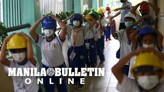 Pupils and teachers in Malate, Manila join the Nationwide Simultaneous Earthquake Drill