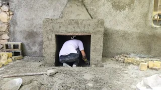 The cooperation of a village man and woman to build a wood-burning fireplace
