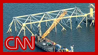 Cleanup crews maneuver to clear Baltimore bridge collapse wreckage