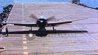 U.S. F6F Hellcats landing on aircraft carrier in Pacific during WW II. Firefighte...HD Stock Footage