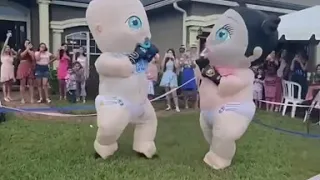Relatives in Baby Costumes Stage Boxing Match for Gender Reveal Party in Jacksonville