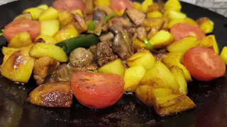 Frying chicken in a plow disk pan by  Azerbaijan cuisine