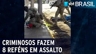 Criminosos fazem 8 reféns em assalto a loja no Rio Grande do Sul | SBT Brasil (07/02/22)