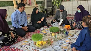 Nowruz Eid at the table of Haft Sin: the joy of Nowruz Eid with a kind man's mother and brother