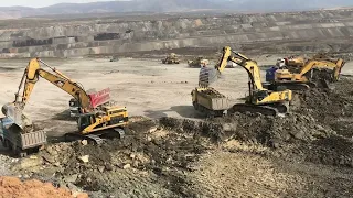 Caterpillar 365C And Komatsu Excavators Loading Mercedes And MAN Trucks