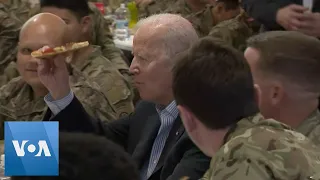 Biden Eats Pizza With US Troops in Poland