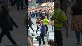 Legend signing at the Coldplay concert