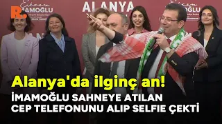 Alanya'da ilginç an: İmamoğlu sahneye atılan cep telefonunu alıp selfie çekti