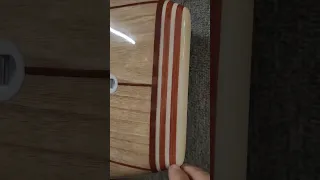 Long boards in custom wood veneer wraps.