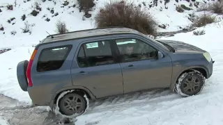 Honda CR-V on a snow hill.