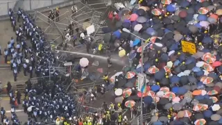 Hong Kong police fire rubber bullets and tear gas at crowd protesting extradition law