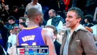 Kobe Bryant goes up to Rick Fox during the Warriors game and shakes his hand