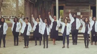 Black medical students pose in front of Louisiana plantation's slave quarters for inspiring picture